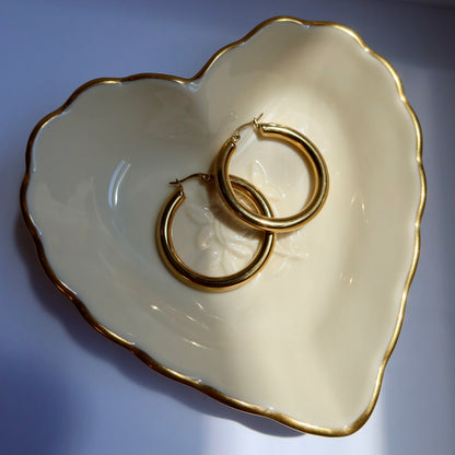Gold plated hoop earrings in heart shaped dishHoop earrings from ShopEternidad.com Affordable 18K Gold Plated Jewelry